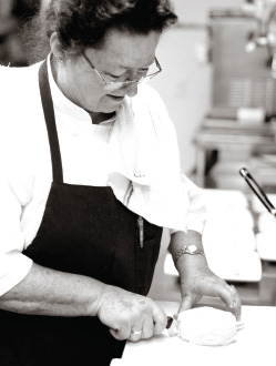 Chef Suzette Gresham with a round of Robiola di Roccaverano DOP is a raw goat milk cheese aged more than 60 days.